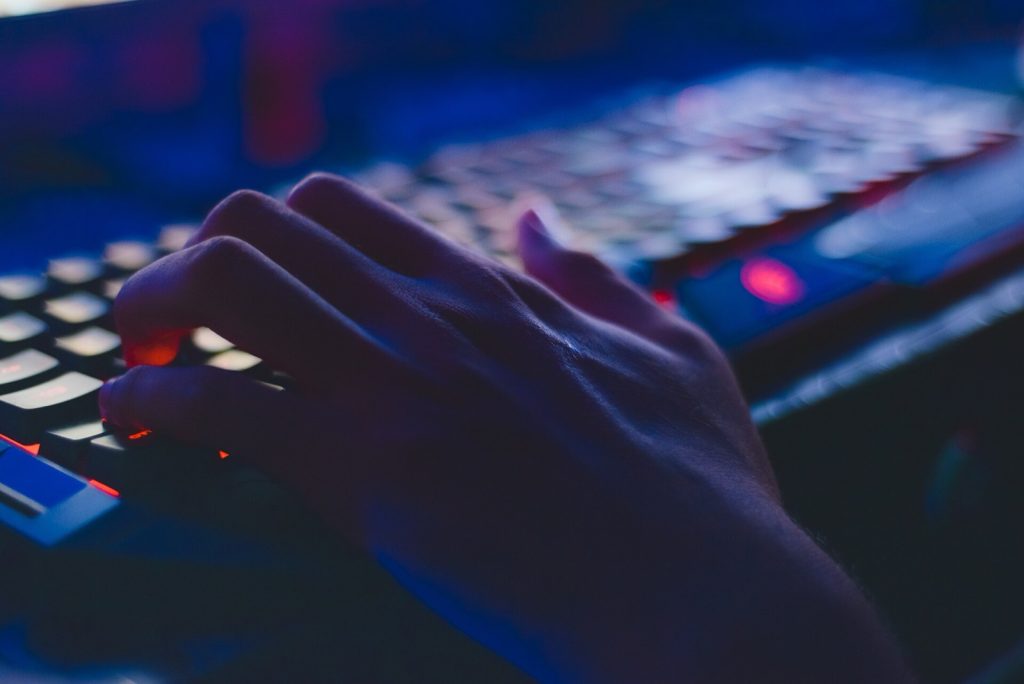 Hand on computer keyboard.