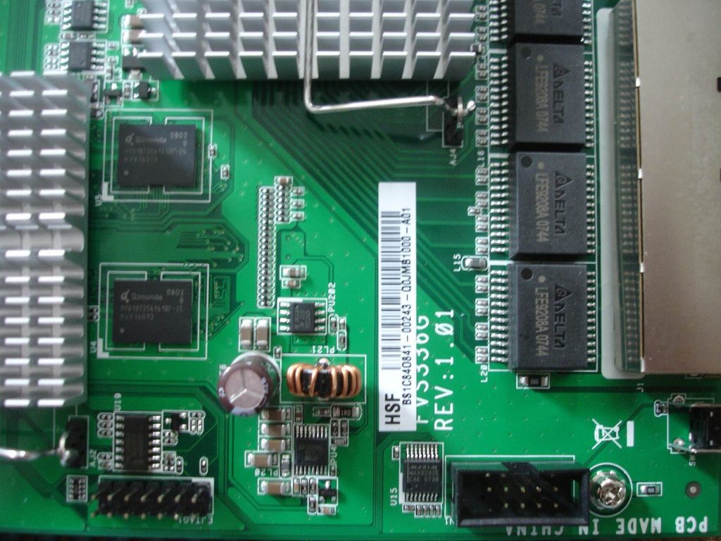 Netgear FVS336G network appliance inside, revealing JTAG interface.