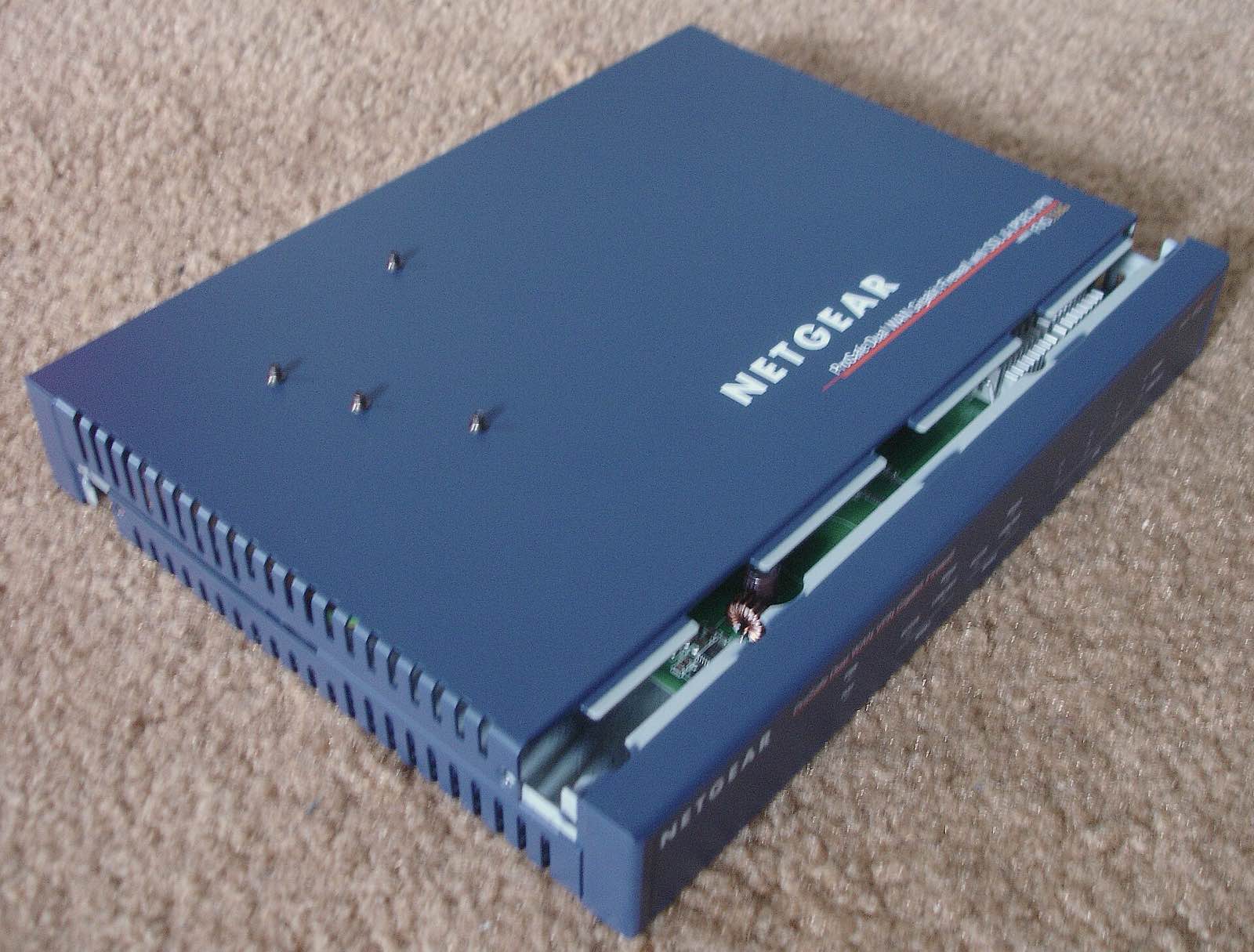 Netgear FVS336G network appliance being opened.